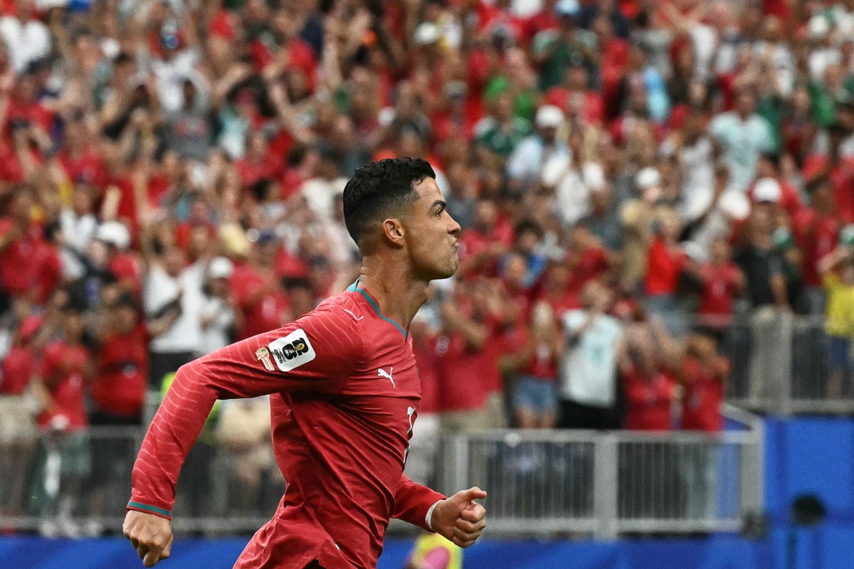 Cristiano Ronaldo celebrates after scoring the opening goal against Uzbekistan. 