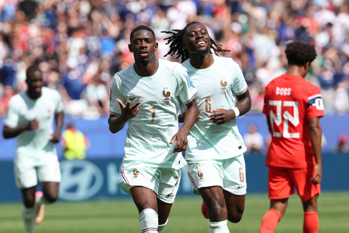 France's forward #07 Ousmane Dembele celebrates scoring his team's third goal with midfielder #06 Manu Kone during the 2026 World Cup Group I football match between Norway and France at the Boston Stadium in Foxborough on June 26, 2026. (Photo by FRANCK FIFE / AFP)