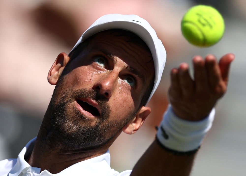 Serbia's Novak Djokovic throws the ball to serve against US player Tommy Paul during their men's singles match on day four of the Giorgio Armani Tennis Classic tournament at the Hurlingham Club in London on June 26, 2026. (Photo by Henry Nicholls / AFP)
