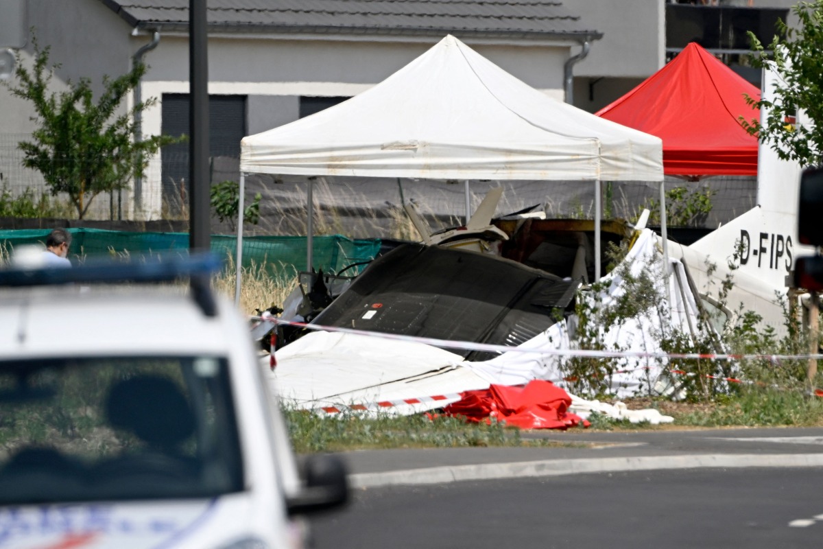 This photograph shows the wreckage of a Pilatus PC-6 light aircraft after it crashed at Tomblaine, on the outskirts of Nancy, eastern France on June 28, 2026. Photo by Jean-Christophe VERHAEGEN / AFP