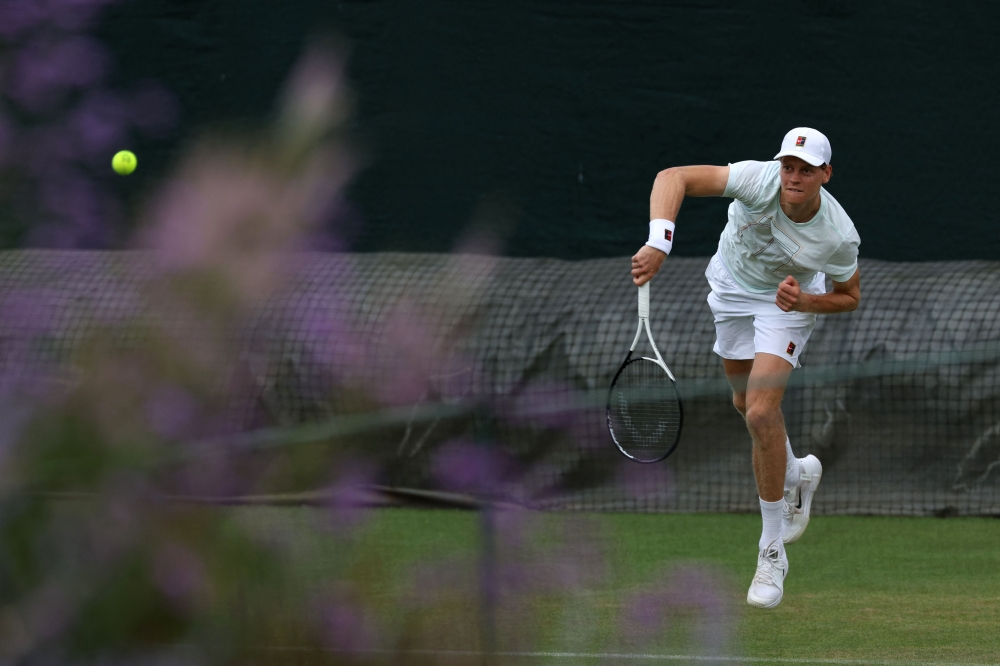 Italy's Jannik Sinner returns to his training partner at the practice courts at The All England Lawn Tennis and Croquet Club in Wimbledon on June 28, 2026. (Photo by Adrian Dennis / AFP)