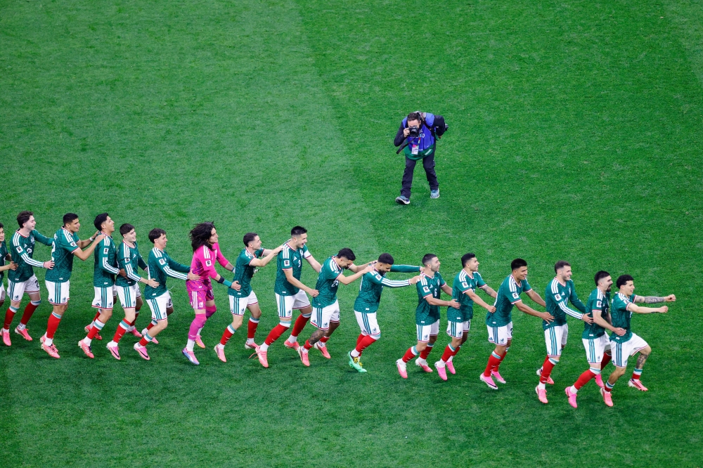 Mexico's players celebrate after winning the 2026 World Cup round of 32 football match between Mexico and Ecuador at the Mexico City Stadium in Mexico City on June 30, 2026. (Photo by Rodrigo Oropeza / AFP)
