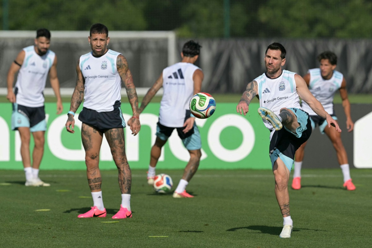 Argentina’s Lionel Messi (right) takes part in a training session with teammates. (AFP)