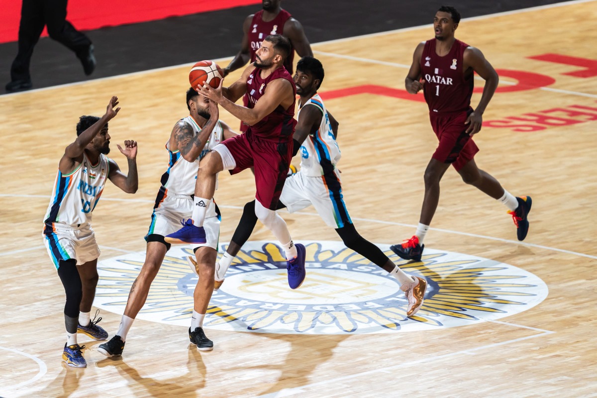 Action during the match between Qatar and India.