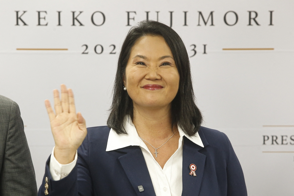 Peru president-elect for the Fuerza Popular party, Keiko Fujimori, waves as she gives a statement at her campaign headquarters in the San Borja district of Lima on July 3, 2026. (Photo by AFP)
