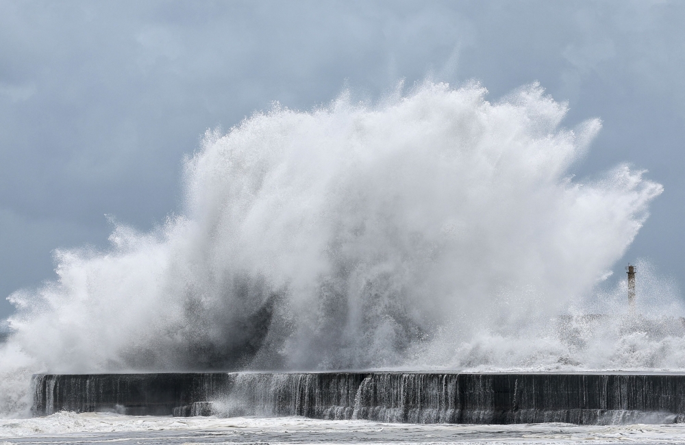 Strong waves break along the coast in Yilan on July 10, 2026, as Typhoon Bavi moves toward Northeastern Taiwan. (Photo by I-Hwa Cheng / AFP)