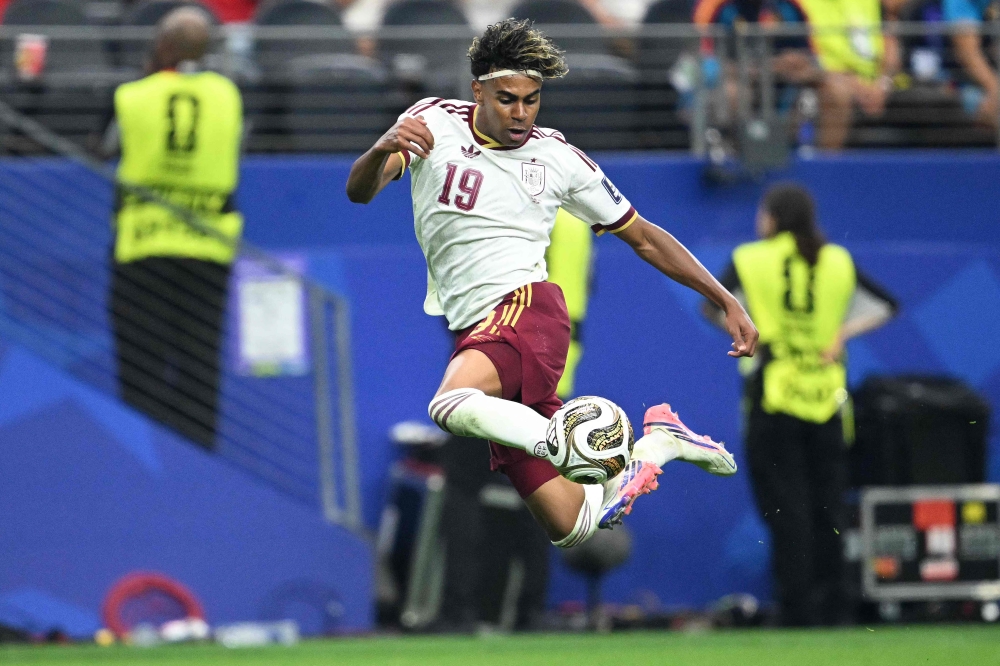 Spain's forward #19 Lamine Yamal controls the ball during the 2026 World Cup football tournament semi-final match on July 14, 2026. (Photo by Mauro Pimentel / AFP)