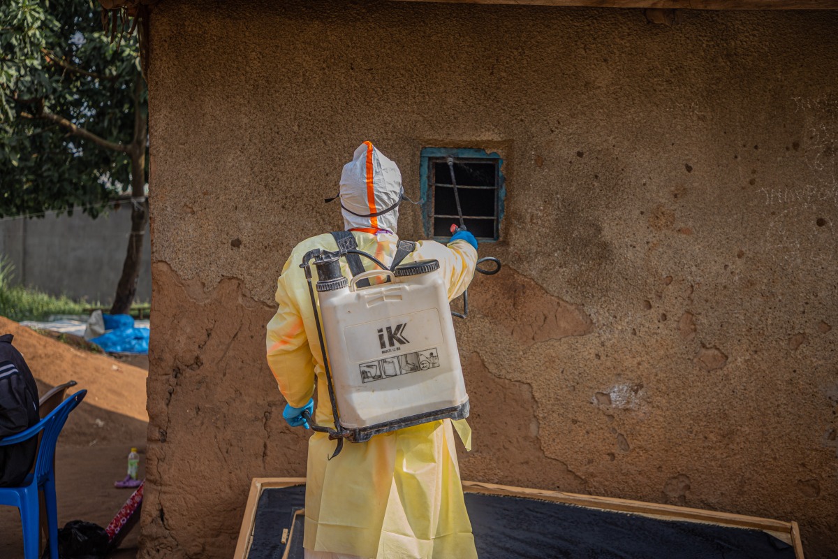 A medical worker performs disinfection before burying a deceased person infected with the Ebola virus in Bunia, the capital of Ituri Province in the Democratic Republic of the Congo, July 9, 2026. (Xinhua)