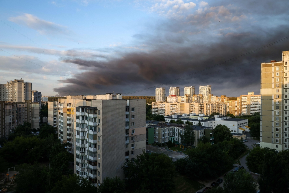 Smoke hangs in the air following Russian missile strikes on the Ukrainian capital of Kyiv on July 19, 2026, amid the Russian invasion in Ukraine. (Photo by Serhii Okunev / AFP)