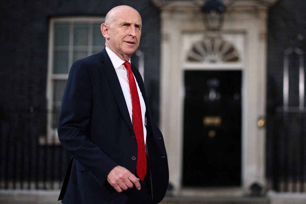 Britain's former Defence secretary John Healey leaves 10 Downing Street in London July 20, 2026 as cabinet appointments are being made after Andy Burnham became Britain's new Prime Minister. (Photo by Henry Nicholls / AFP)