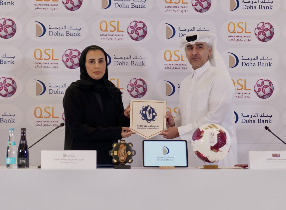  Executive Director of Sales, Marketing and Communication at QSL Hassan Rabiah Al Kuwari and Head of Marketing and Public Relations, Doha Bank, Al Anoud Khalid Al Attiyah during the partnership signing ceremony.