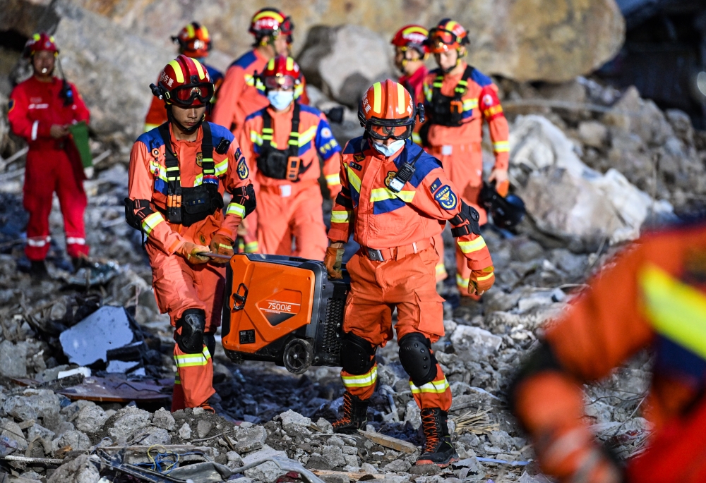Rescuers work at the site of a landslide in Pengshui Miao and Tujia Autonomous County, southwest China's Chongqing Municipality, July 18, 2026. (Xinhua/Wang Quanchao)