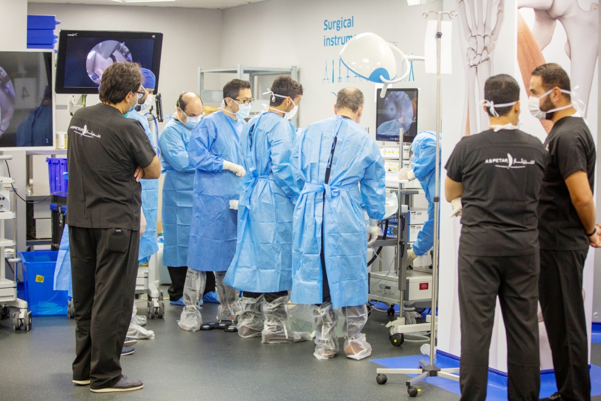 Surgeons and physicians work during the training programme.