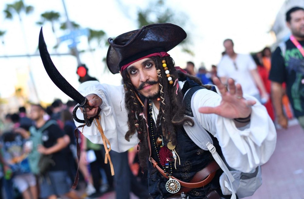 A Jack Sparrow pirate cosplayer poses outside the Convention Center during Comic Con International in San Diego on July 23, 2026. (Photo by Chris Delmas / AFP)