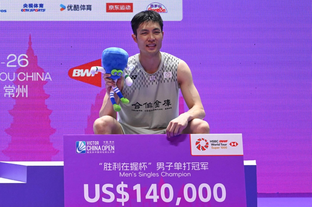 Taiwan's Chou Tien-chen poses on the podium at China Open badminton tournament in Changzhou, eastern China's Jiangsu province on July 26, 2026. (Photo by CN-STR / AFP)