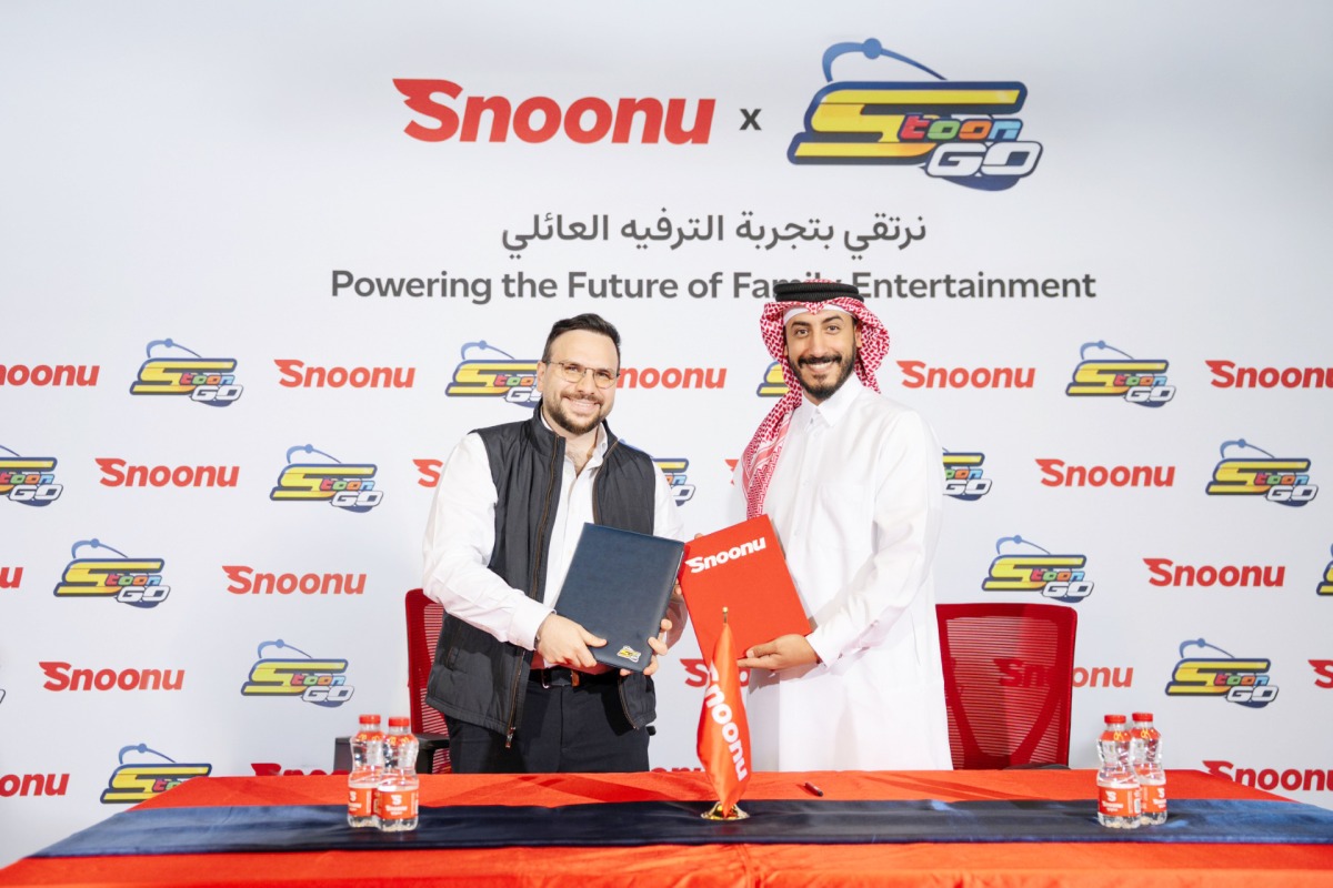 Snoonu and Spacetoon Go officials during the signing of the agreement. 