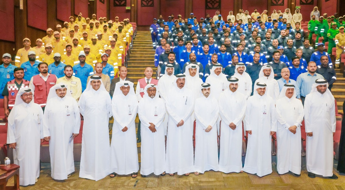 Officials with workers during the event.