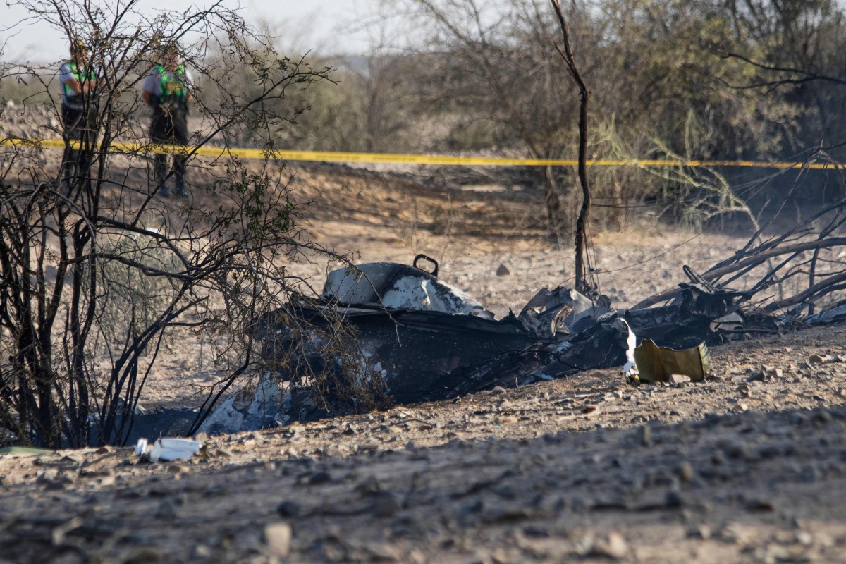 Wreckage of the small plane involved in a fatal accident that claimed the lives of its 13 occupants is pictured in the Vista Alegre district, Nazca, Peru, on August 1, 2026. Photo by Mariajulia VAREMAN / AFP
