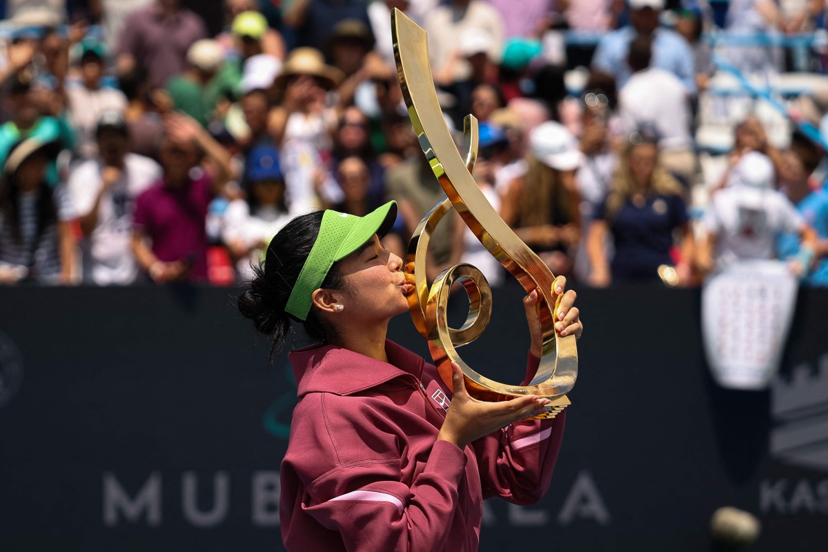 Alexandra Eala of the Philippines kisses the Championship Trophy after winning the women's singles championship match against Jessica Pegula of the United States on the final day of the Mubadala DC Open 2026 at William H.G. FitzGerald Tennis Center on August 3, 2026 in Washington, DC. Scott Taetsch/Getty Images/AFP 