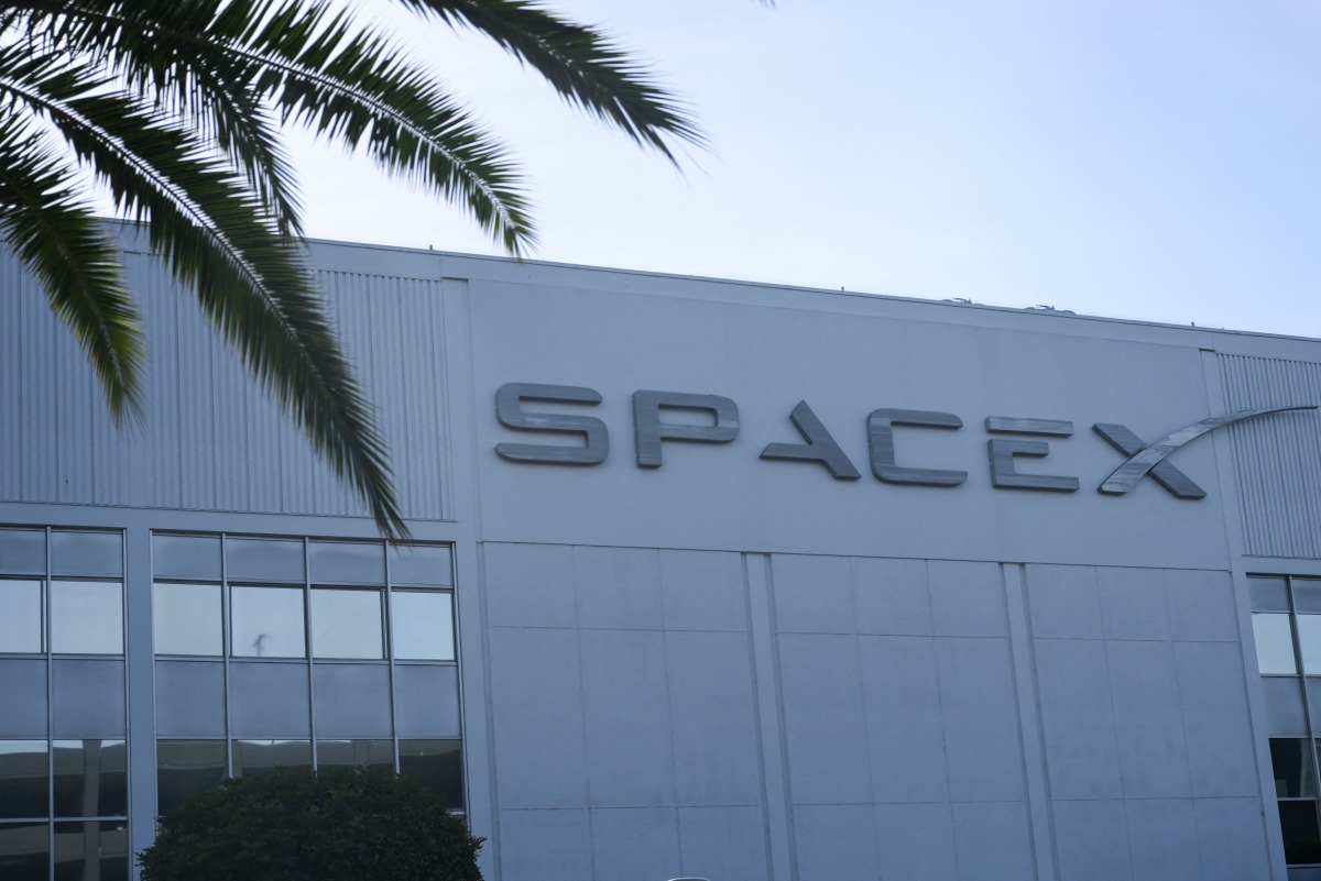 The SpaceX logo is displayed outside a Space Exploration Technologies Corp. facility in Hawthorne, California, on June 8, 2026. Photo by Patrick T. Fallon / AFP