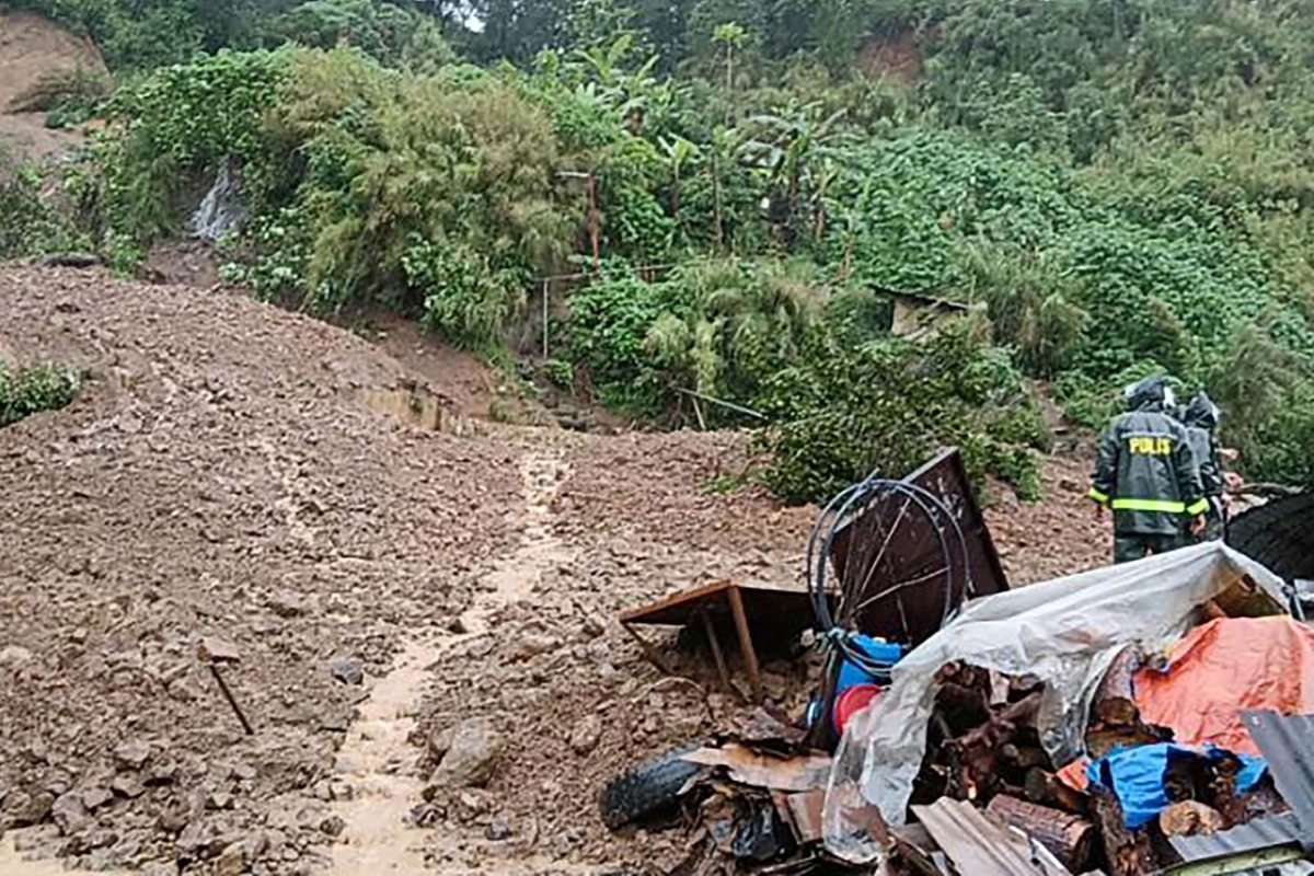 Rescuers work at a landslide site which hit a small restaurant burying three employees who had been in the kitchen, at a village in La Trinidad, Benguet province on August 6, 2026. Photo by AFP