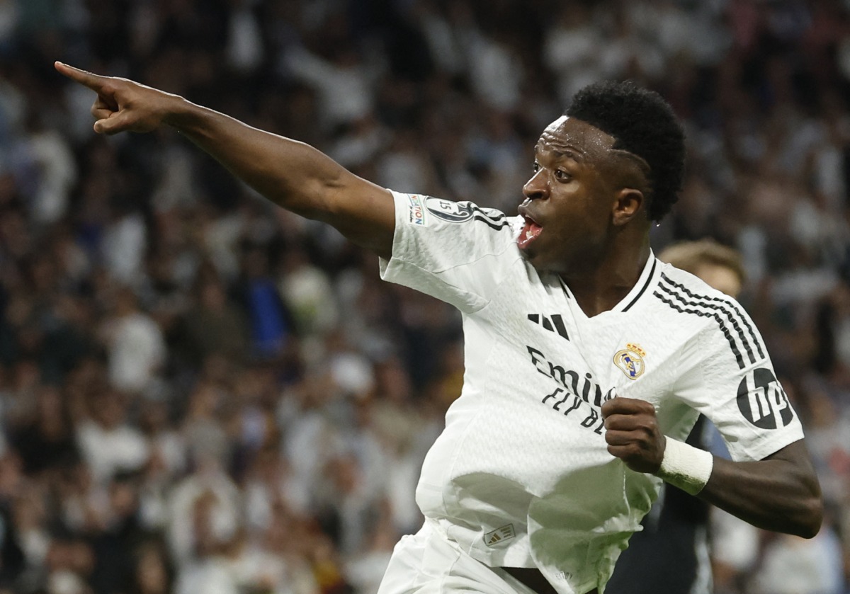 (FILES) Real Madrid's Brazilian forward #07 Vinicius Junior celebrates scoring his team's first goal during the UEFA Champions League quarter final second leg football match between Real Madrid CF and Arsenal at Santiago Bernabeu Stadium in Madrid on April 16, 2025. (Photo by Pierre-Philippe MARCOU / AFP)
