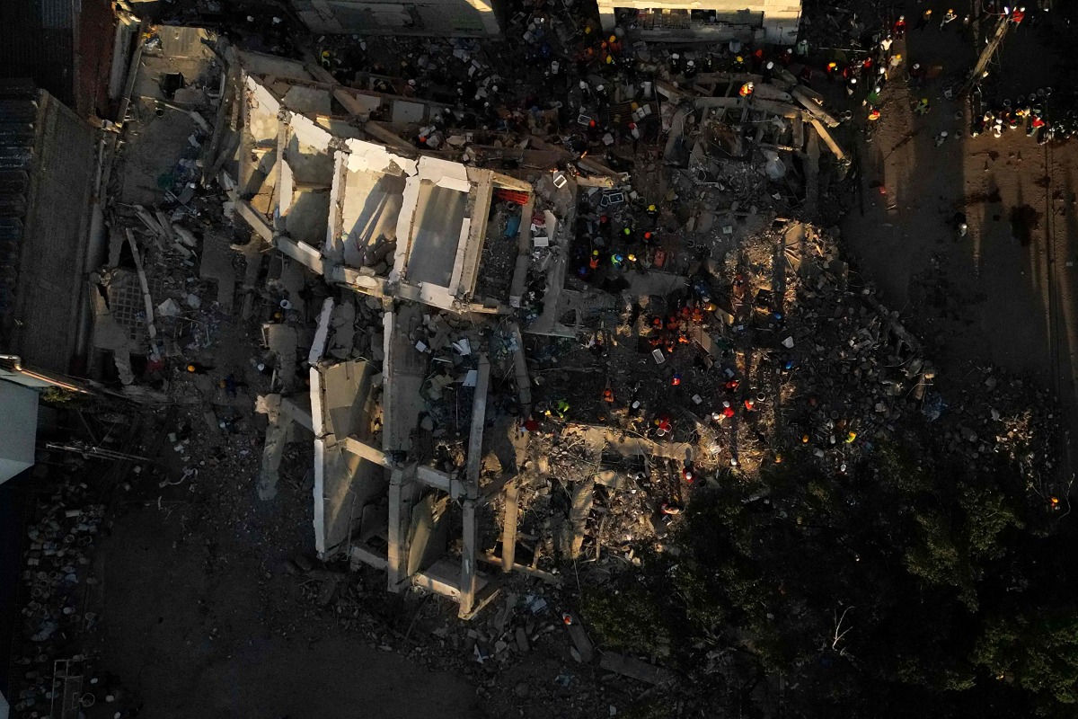 This aerial view shows the rubble of a collapsed building in Cali, Colombia, on August 13, 2026, three days after a 7.4-magnitude earthquake. Photo by Raul ARBOLEDA / AFP