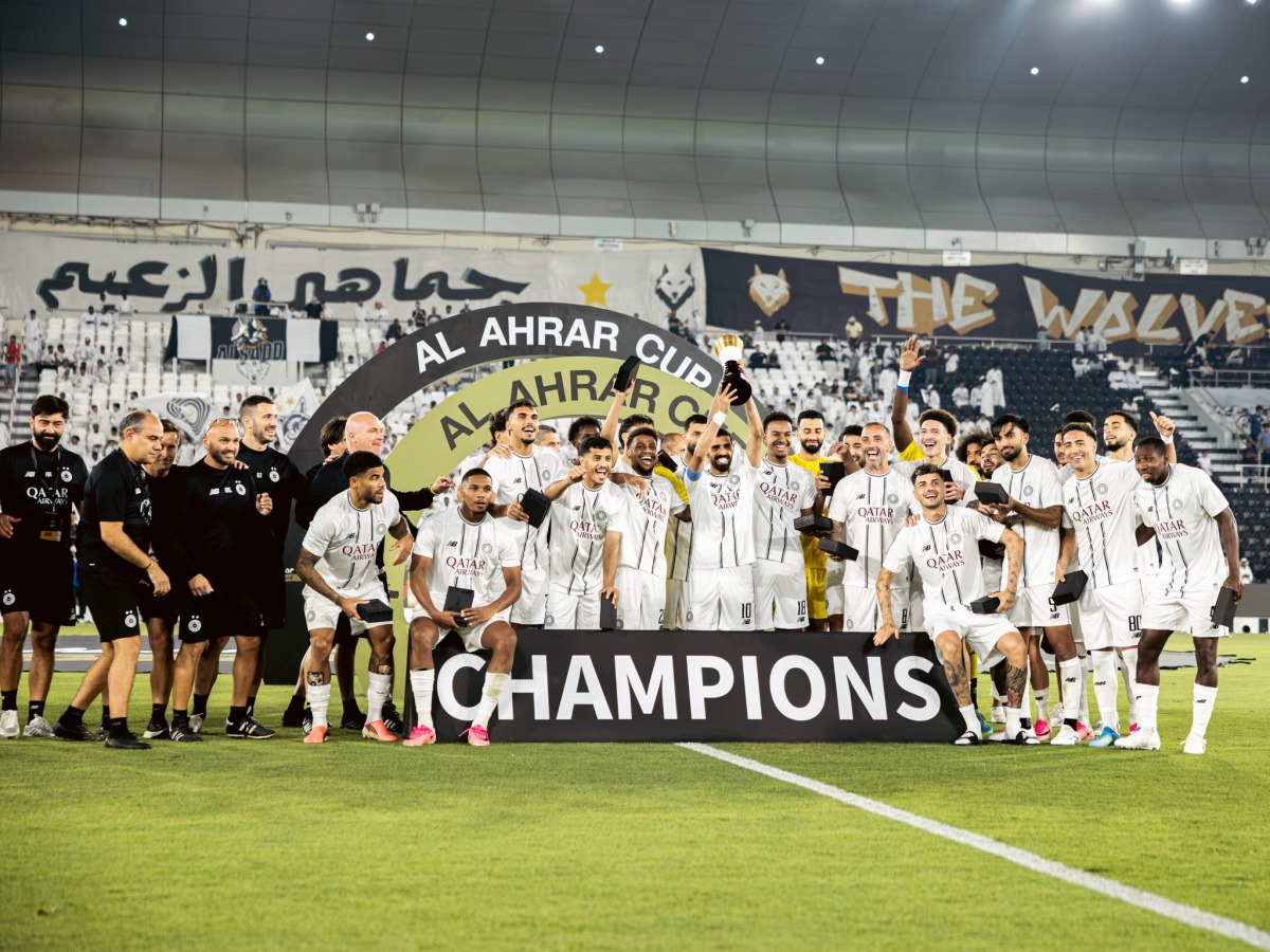 Al Sadd players and officials celebrate after winning Al Ahrar Cup.