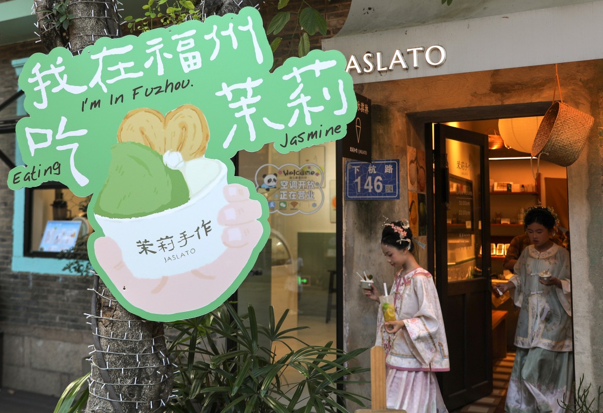 Tourists walk out of a store after buying jasmine tea-flavored gelato at the Shangxiahang historical and cultural block in Fuzhou, southeast China's Fujian Province, Aug. 17, 2026. (Xinhua/Du Xiaoyi). Representational purposes only.