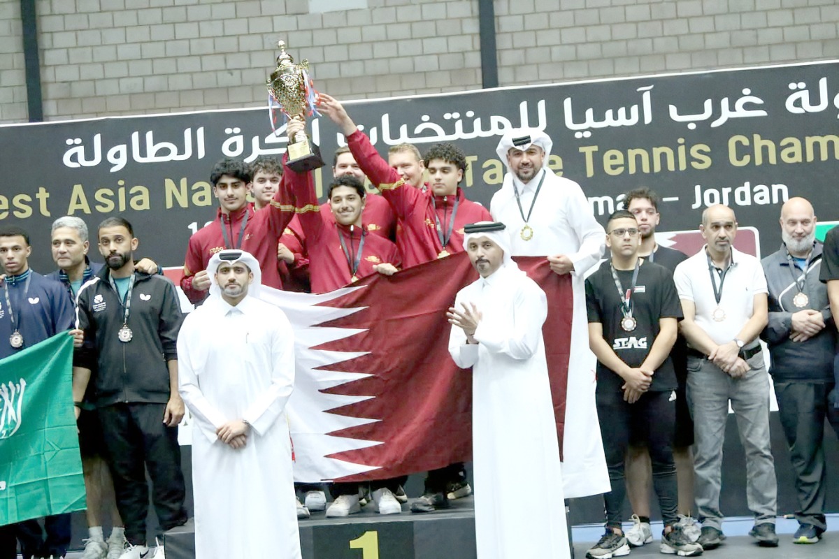 Qatar Table Tennis Association officials pose for photos with victorious Team Qatar players. 