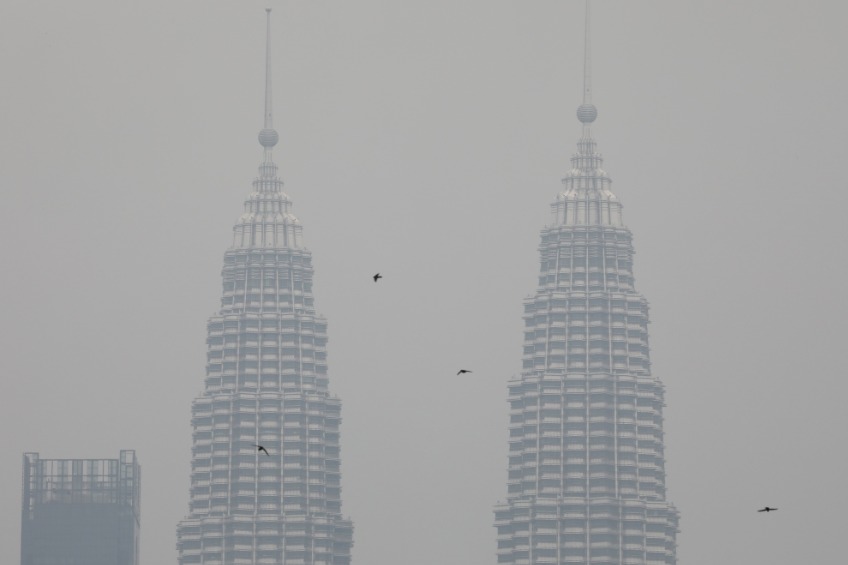 Petronas twin towers shrouded by haze in Kuala Lumpur. Reuters file photo.