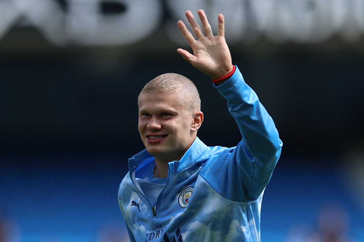 Manchester City's Norwegian striker #09 Erling Haaland, sporting a new hair cut, warms up ahead of the English Premier League football match between Manchester City and AFC Bournemouth at the Etihad Stadium in Manchester, north west England, on August 23, 2026. (Photo by Darren Staples / AFP)