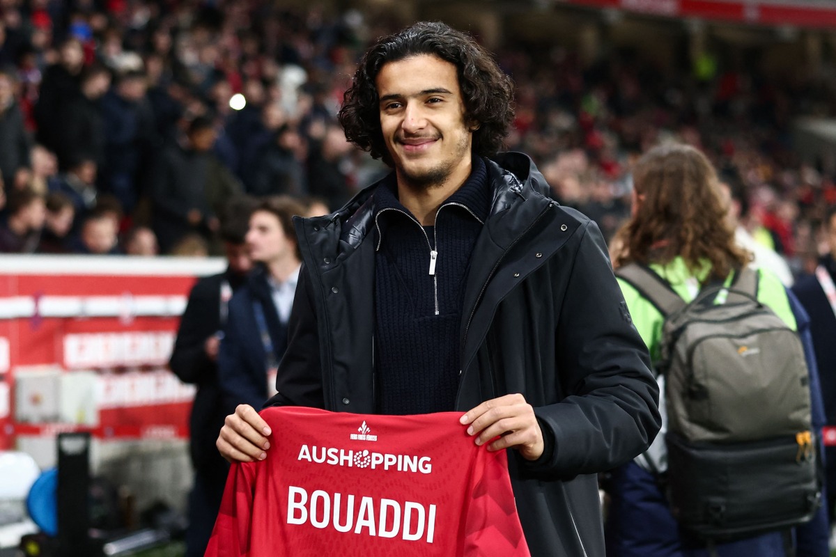 Lille's French midfielder #32 Ayyoub Bouaddi poses for a photograph with a jersey reading 