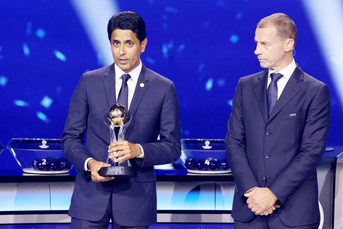 PSG President Nasser Al-Khelaifi (left) speaks after receiving an award from UEFA President Aleksander Ceferin during the draw ceremony yesterday. 