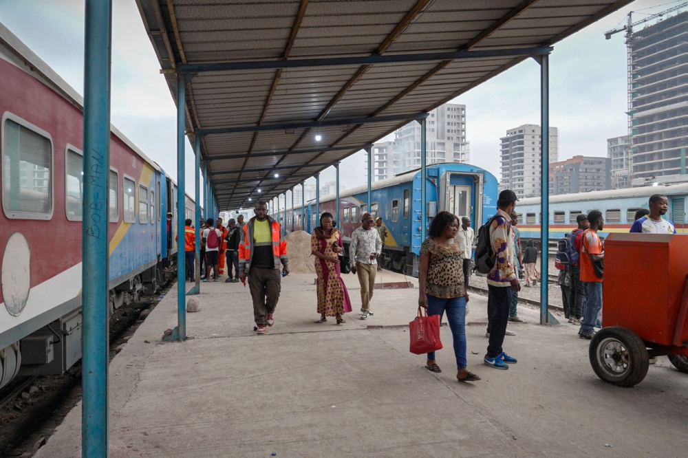 This screen grab taken from an AFP Video shows commuters walking on the platform as they leave the train at the central station in Kinshasa, on August 28, 2026. (Photo by GLODY MURHABAZI / AFP)