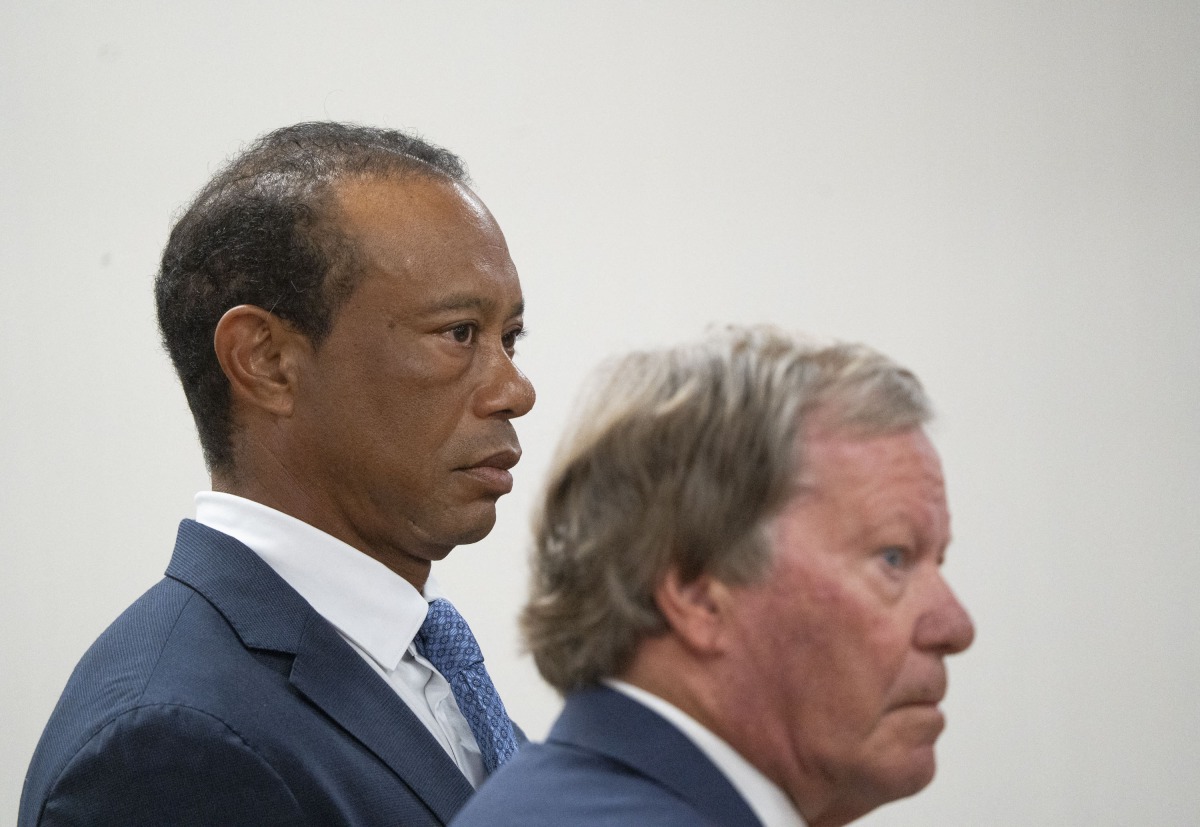 US golfer Tiger Woods (L) appears in County Judge Darren Steele's courtroom for a plea hearing from an arrest in March at the Martin County Courthouse in Stuart, Florida in September 2, 2026. Photo by Crystal Vander Weit / POOL / AFP