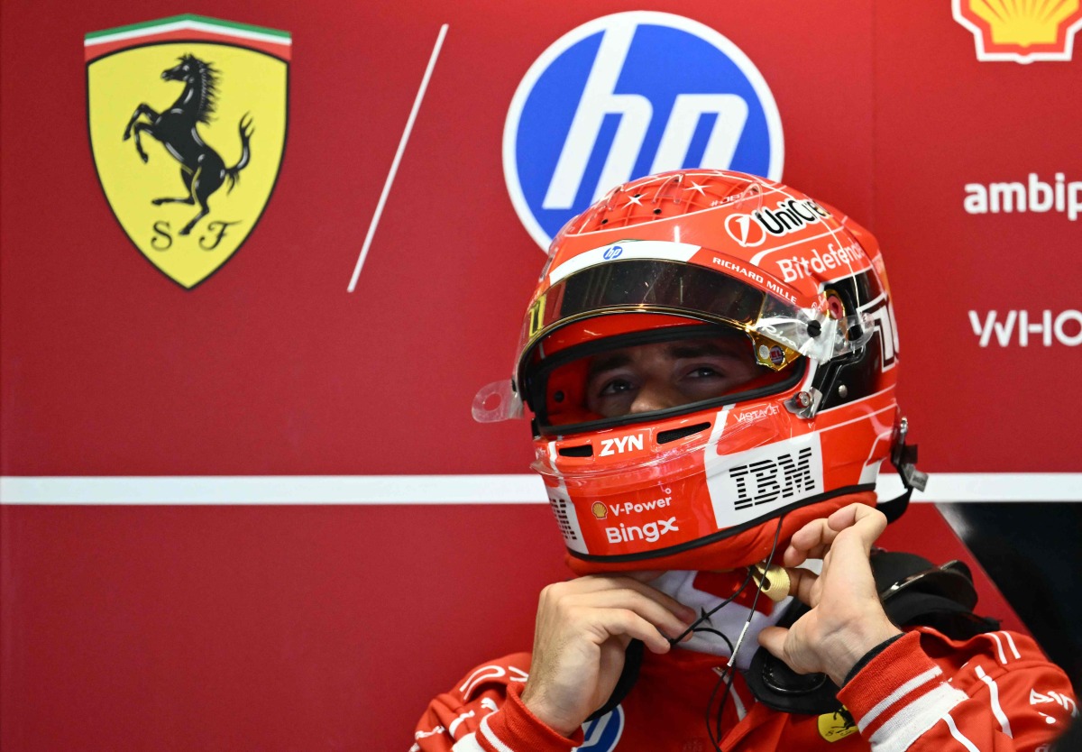 Ferrari's Monegasque driver Charles Leclerc takes off his helmet in the pits after the first practice session of the Italian Formula One Grand Prix at the Autodromo Nazionale Monza circuit in Monza, northern Italy on September 4, 2026. (Photo by Marco BERTORELLO / AFP)
