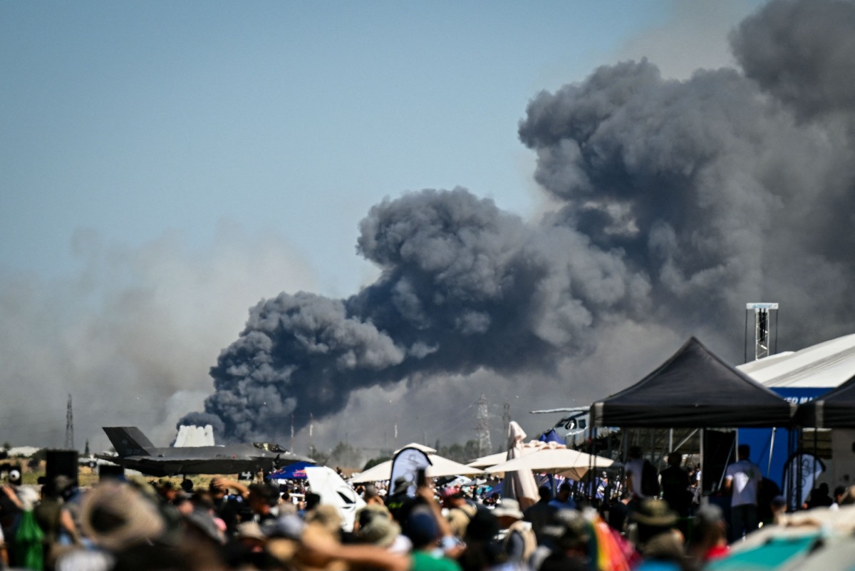 Smoke rises after a Phantom F-4 military jet crashed during the Athens Flying Week air show at the military airport of Tanagra, near Athens on September 5, 2026. (Photo by Theophile BLOUDANIS / AFP)
