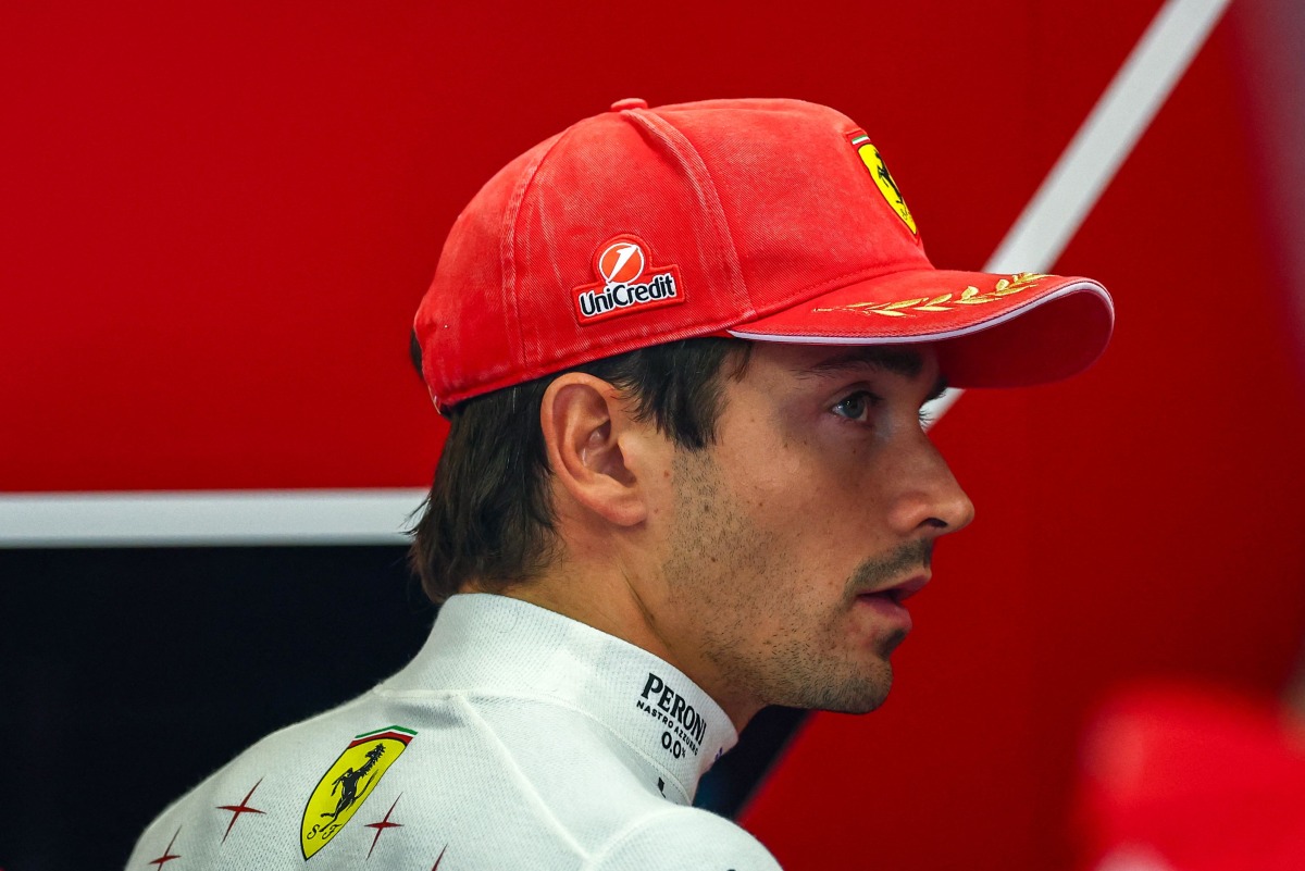 Ferrari's Monegasque driver Charles Leclerc looks on in the pits ahead of the qualifying session of the Italian Formula One Grand Prix at the Autodromo Nazionale Monza circuit in Monza, northern Italy on September 5, 2026. (Photo by ANNA SZILAGYI / POOL / AFP)