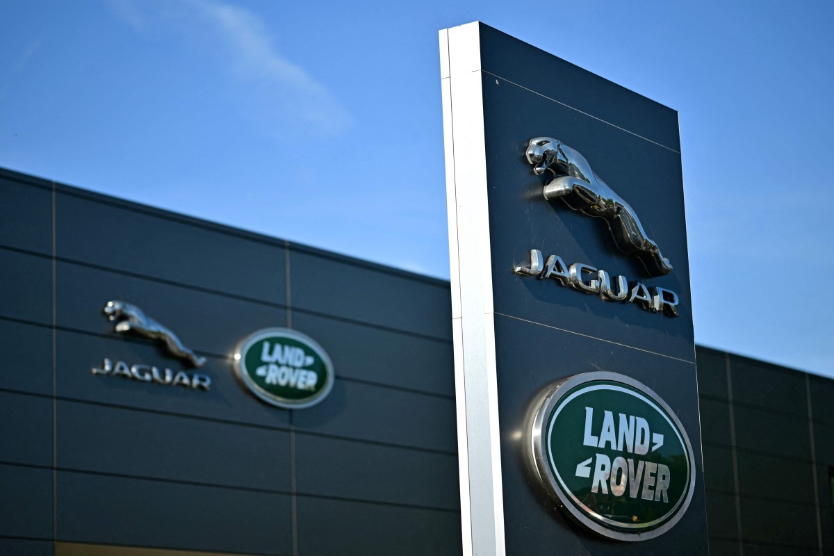 Jaguar Land Rover signage is seen on a dealership in Tonbridge, south-east of London on September 29, 2025. Photo by Ben STANSALL / AFP
