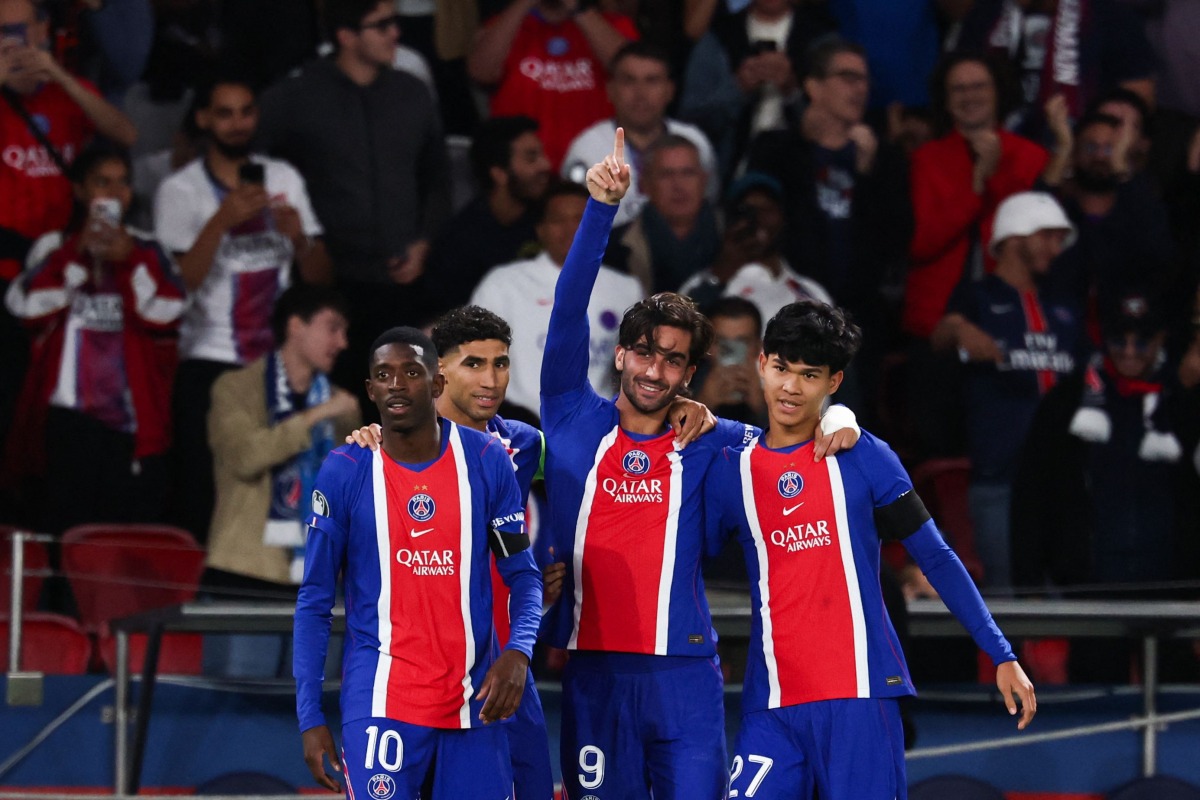 Paris Saint-Germain's Spanish forward #09 Ferran Torres (C) celebrates with Paris Saint-Germain's French forward #10 Ousmane Dembele (L), Paris Saint-Germain's Moroccan defender #02 Achraf Hakimi (2nd L) and Paris Saint-Germain's Spanish midfielder #27 Dro Fernandez (R) after scoring his team fourth goal during the UEFA Champions League, league phase, matchday 1, football match between Paris Saint-Germain (PSG) and Slovan Bratislava at the Parc des Princes Stadium in Paris on September 9, 2026. (Photo by FRANCK FIFE / AFP)