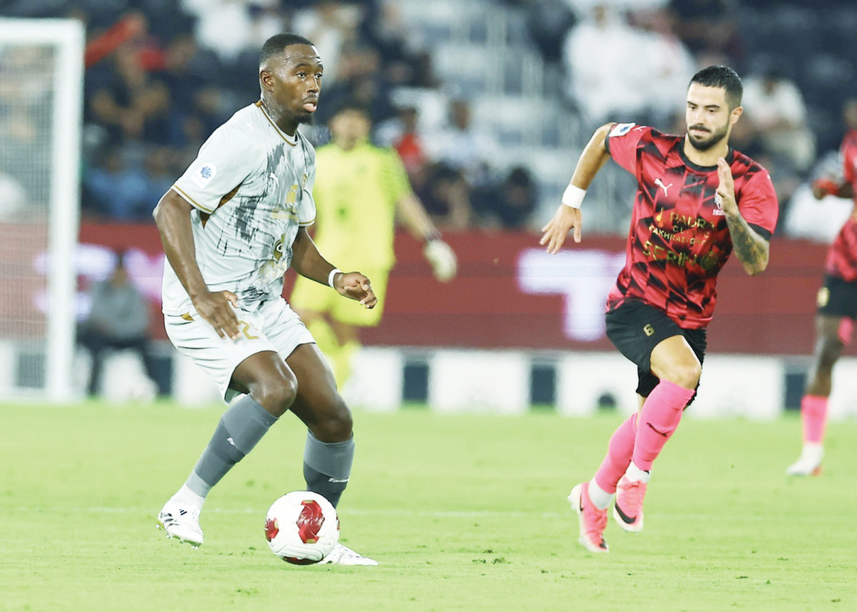 Al Duhail's Boubakary Soumare (left) controls the ball.