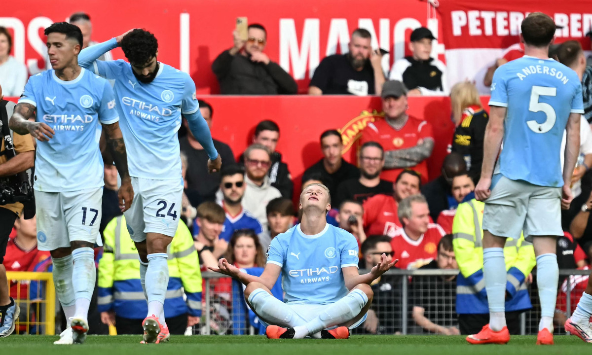Manchester City's Norwegian striker #09 Erling Haaland celebrates scoring the team's first goal during the English Premier League football match between Manchester United and Manchester City at Old Trafford in Manchester, north-west England, on September 13, 2026. (Photo by Paul ELLIS / AFP)