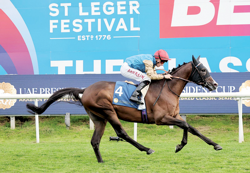 Tom Marquand rides Romeo At during the race.