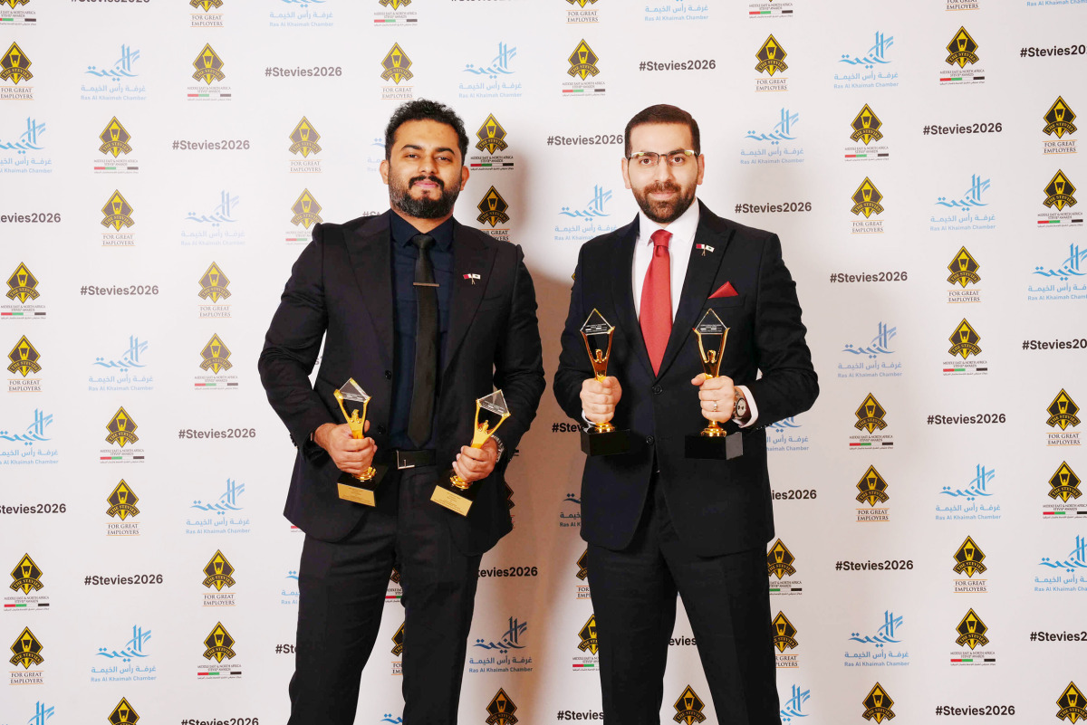 Ahmed Alkahlout and Fajir Abdul Majeed pose with the awards during the ceremony.