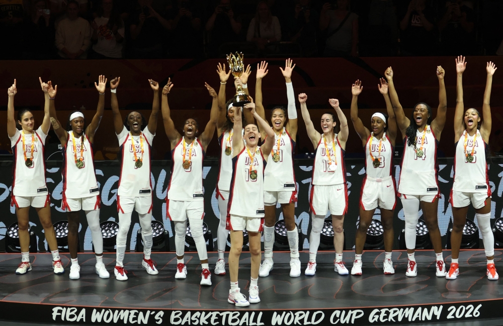 US' power forward #10 Breanna Stewart lifts the trophy after winning with her team the 2026 FIBA Women Basketball World Cup final game against France in Berlin on September 13, 2026. (Photo by Odd ANDERSEN / AFP)
