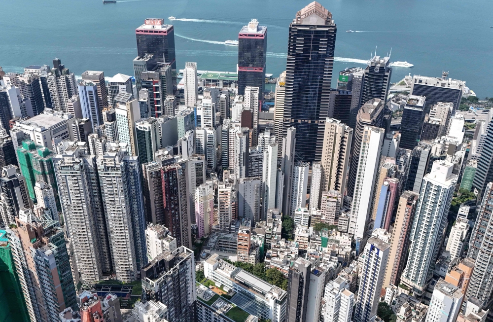 An aerial view shows high-rise buildings in the Central district of Hong Kong on September 16, 2026. (Photo by Peter Parks / AFP)