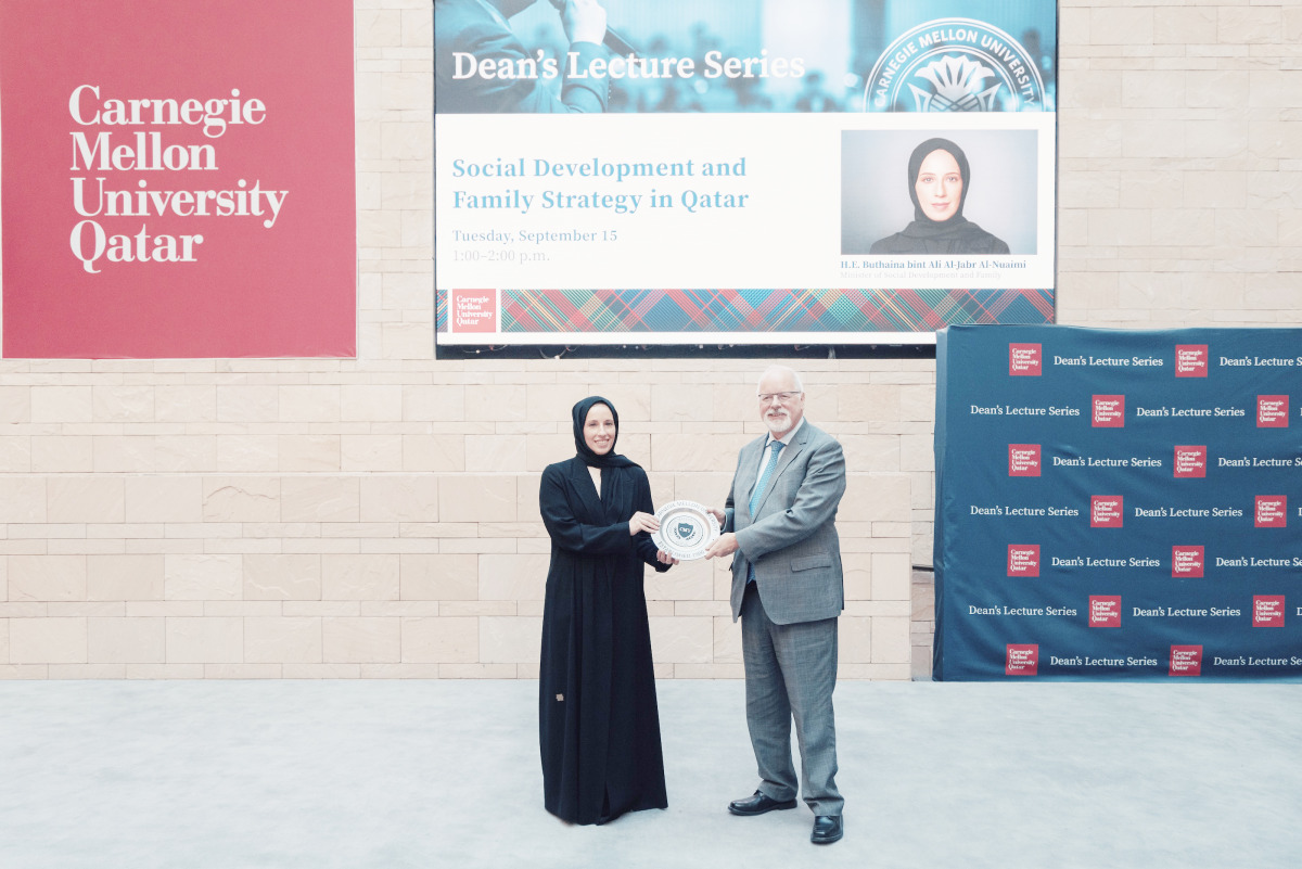 Minister of Social Development and Family H E Buthaina bint Ali Al-Jabr Al-Nuaimi receiving a memento from Dean of CMU-Q Michael Trick. 