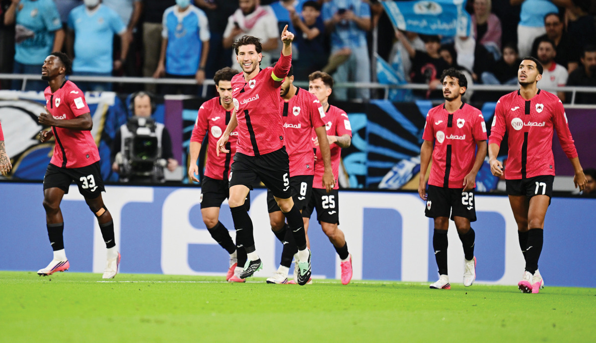 Al Rayyan's David García (third left) celebrates after scoring a goal.