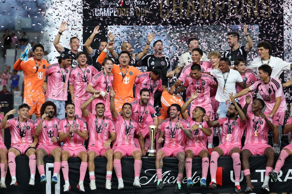 Lionel Messi #10 of Inter Miami CF and teammates celebrate with the Champion's trophy after winning the Campeones Cup 2026 match between Inter Miami CF and Cruz Azul at Nu Stadium on September 16, 2026 in Miami, Florida. Leonardo Fernandez/Getty Images/AFP